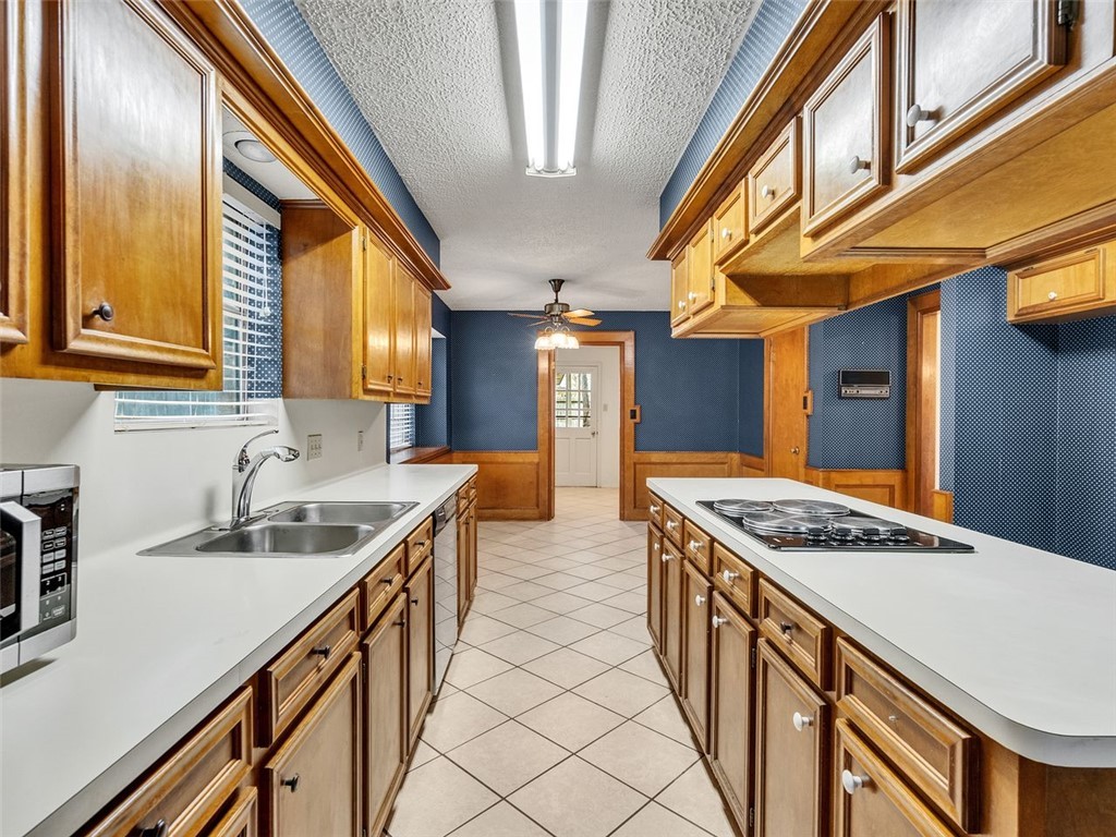 12306 Knobcrest Drive Houston, TX 77070 - Photo 10 of 33 a kitchen with stainless steel appliances granite countertop a sink and stove