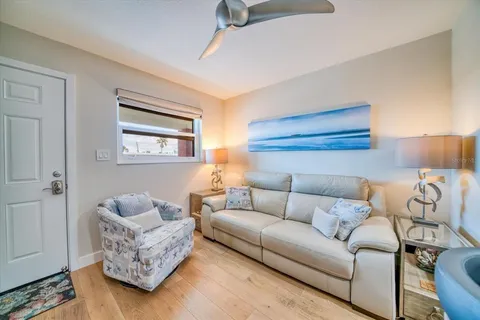 a kitchen with stainless steel appliances kitchen island granite countertop a table chairs stove and refrigerator
