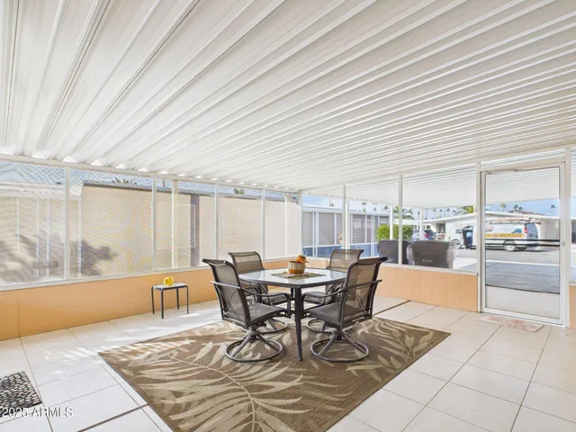 a dining room with furniture and window