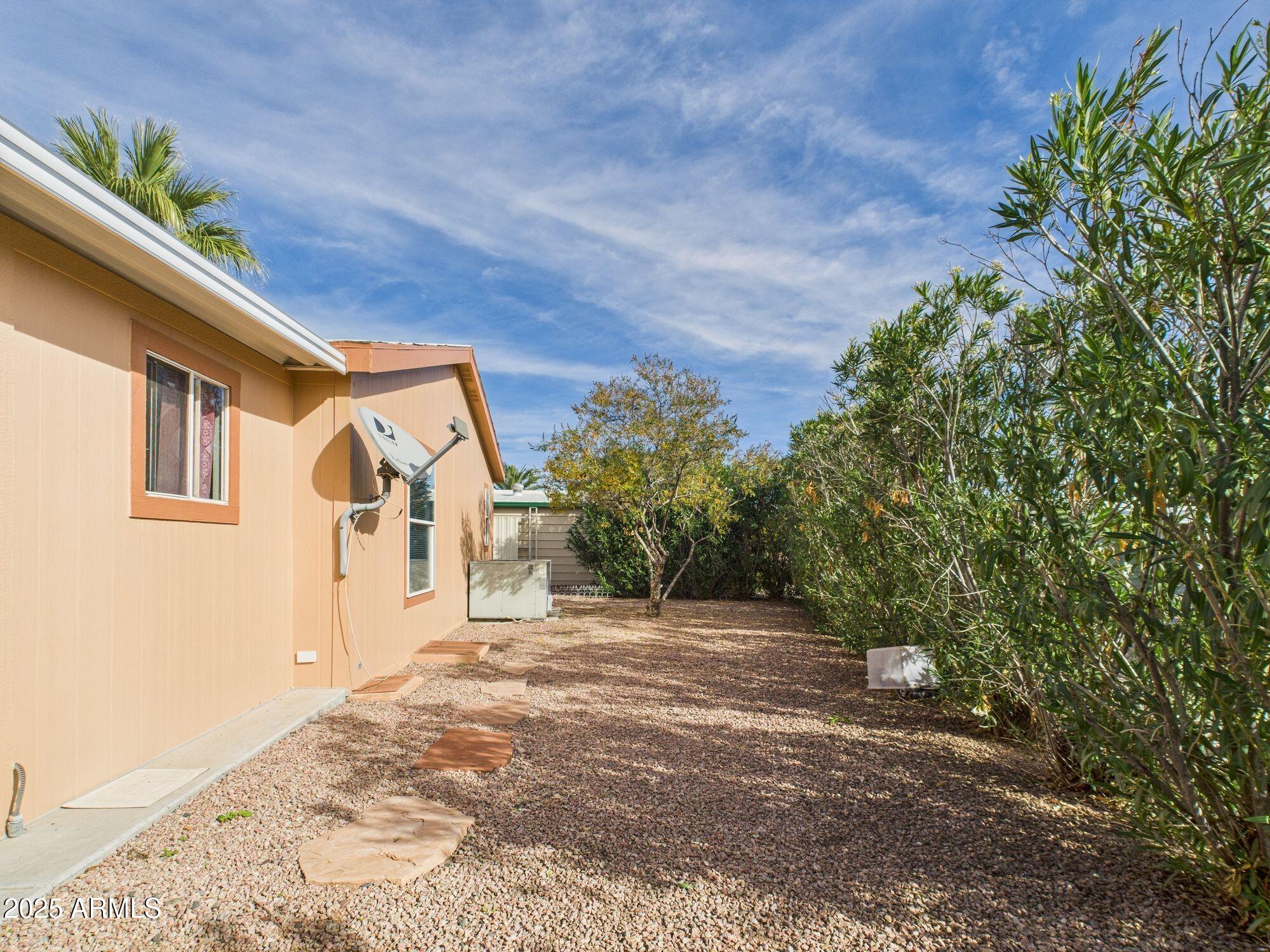 3104 East Broadway Road, Unit 230 Mesa, AZ 85204 - Photo 24 of 24 a view of a house with a yard