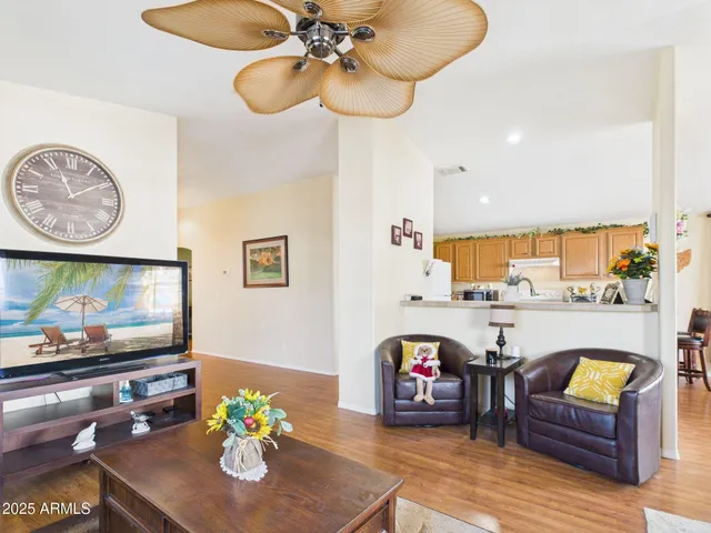 a living room with furniture and flat screen tv