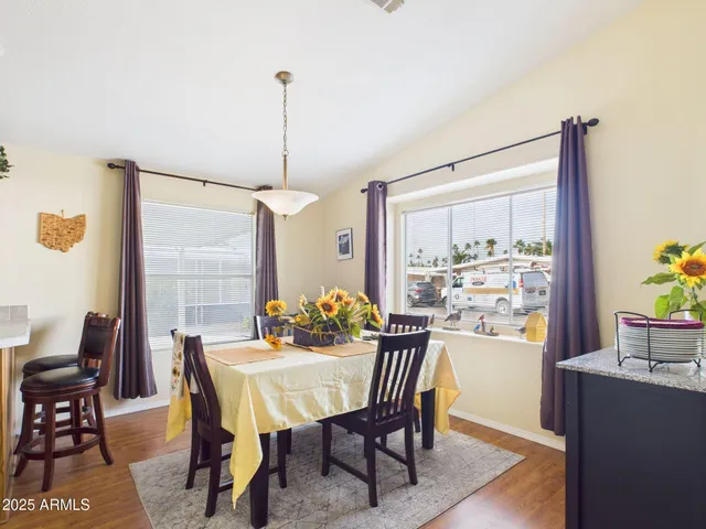 a view of a dining room with furniture window and outside view