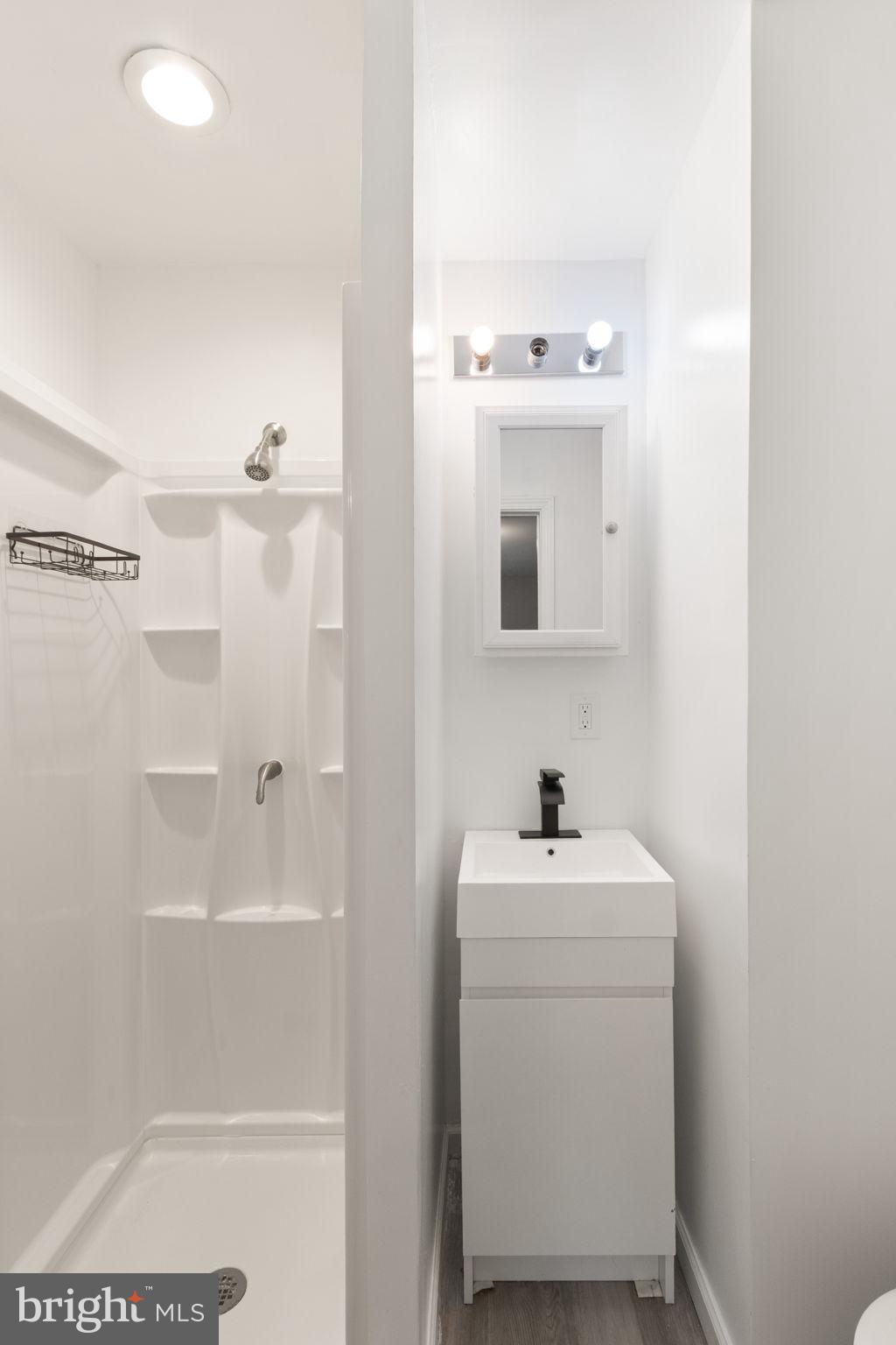 127 Oaklawn Road Stafford, VA 22554 - Photo 23 of 54 a bathroom with a sink mirror and window