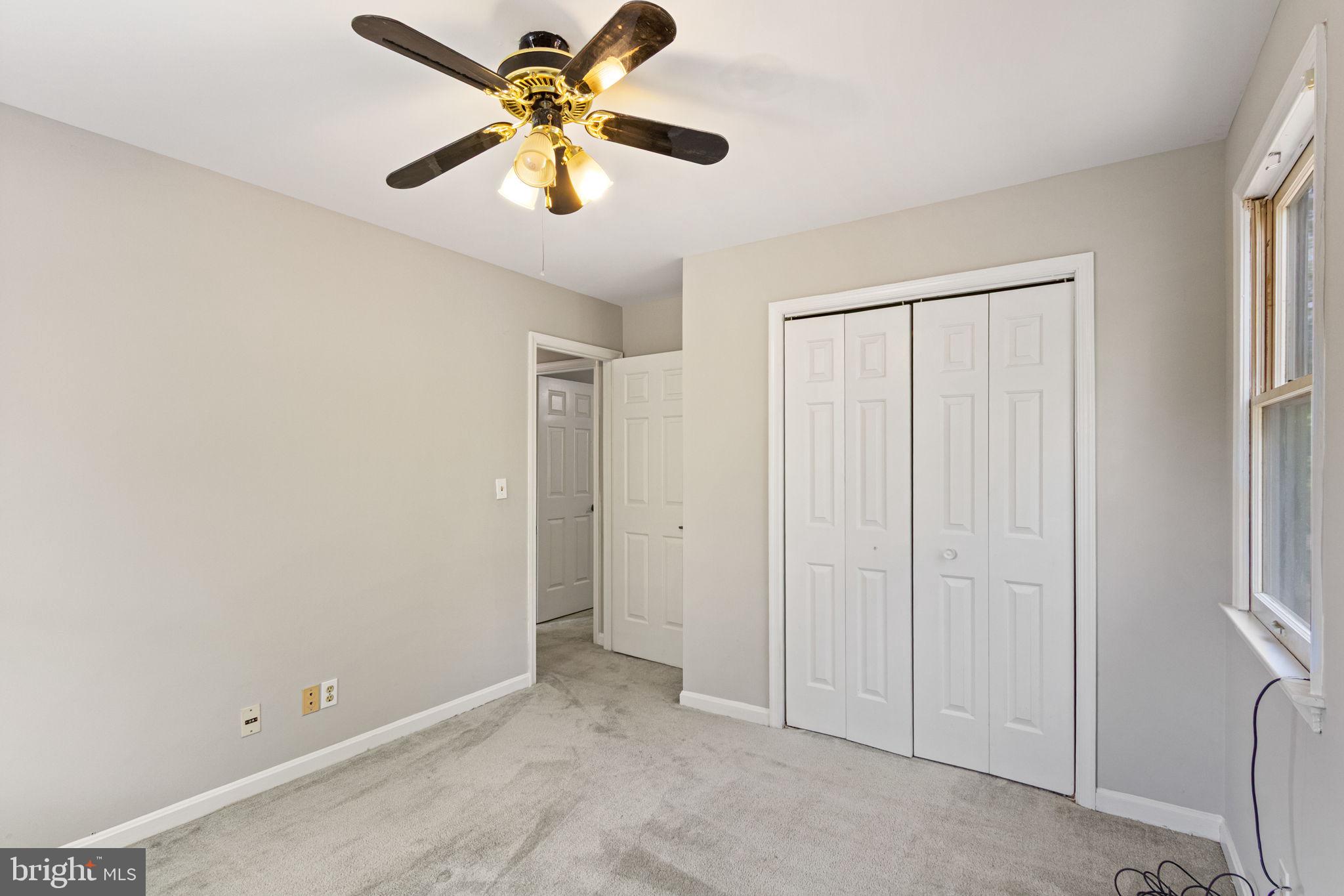 127 Oaklawn Road Stafford, VA 22554 - Photo 30 of 54 an empty room with closet and a chandelier fan