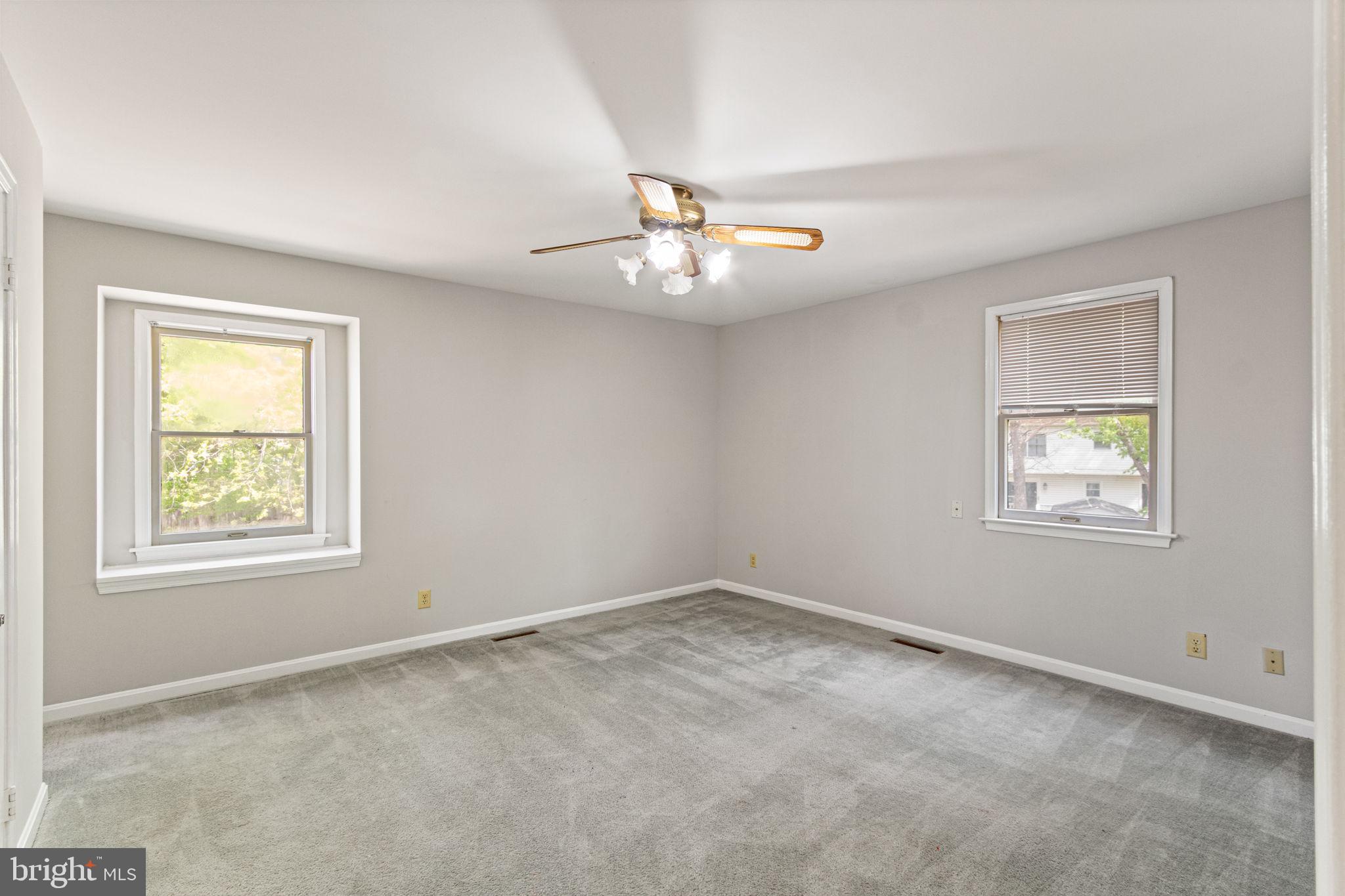127 Oaklawn Road Stafford, VA 22554 - Photo 31 of 54 an empty room with windows and ceiling fan