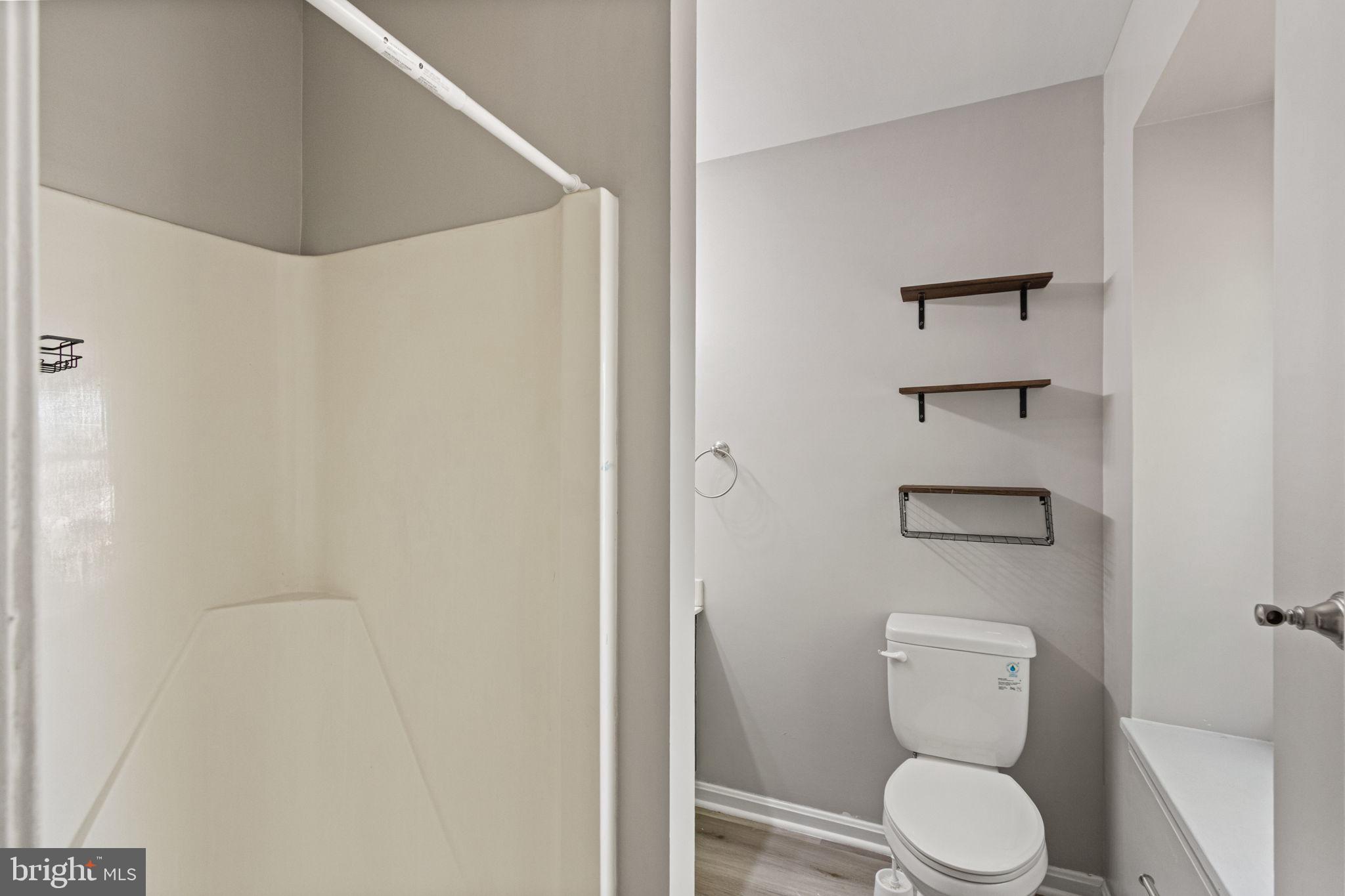 127 Oaklawn Road Stafford, VA 22554 - Photo 33 of 54 a white toilet sitting next to a shower