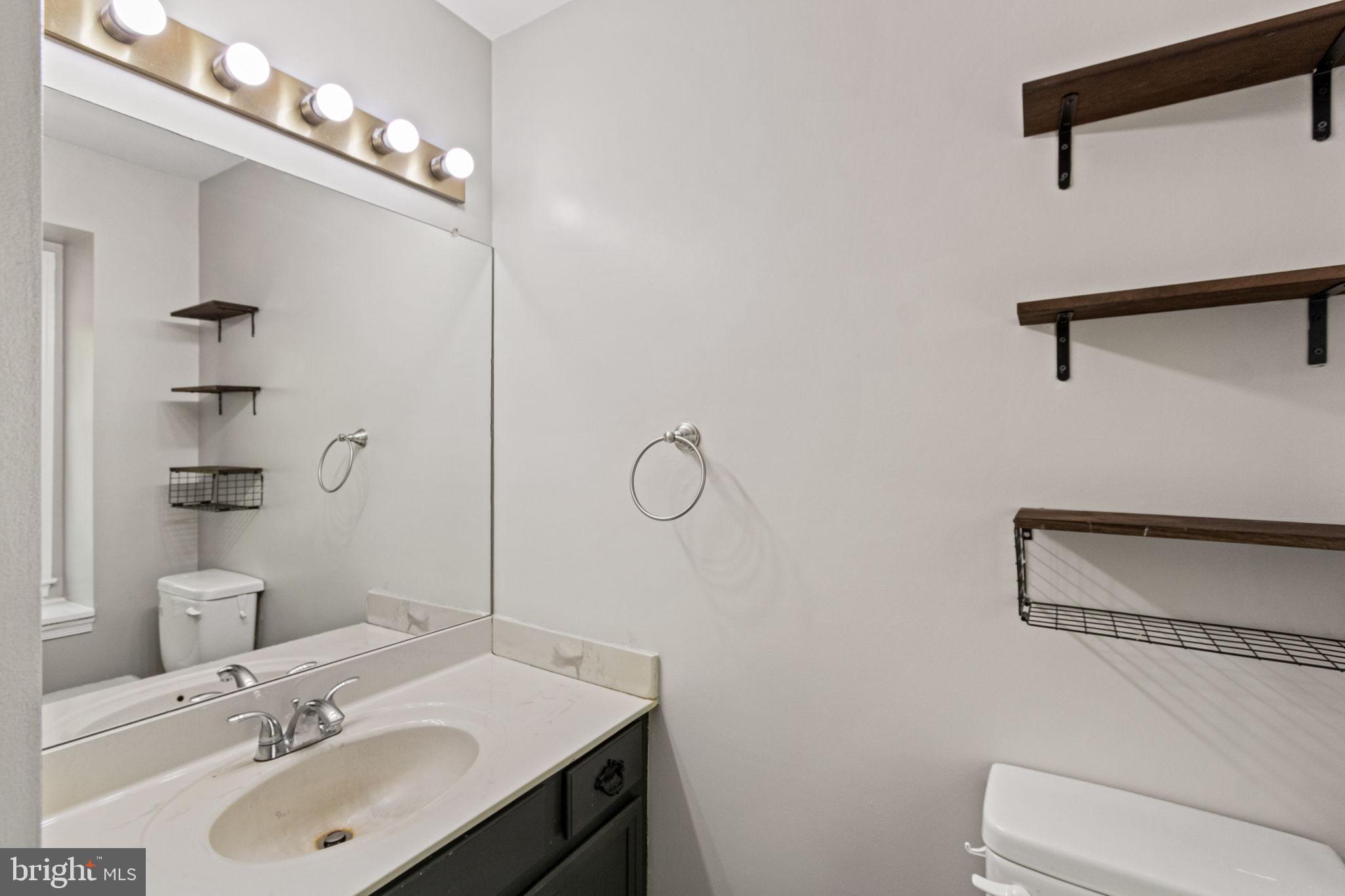 127 Oaklawn Road Stafford, VA 22554 - Photo 34 of 54 a bathroom with a sink vanity mirror and toilet