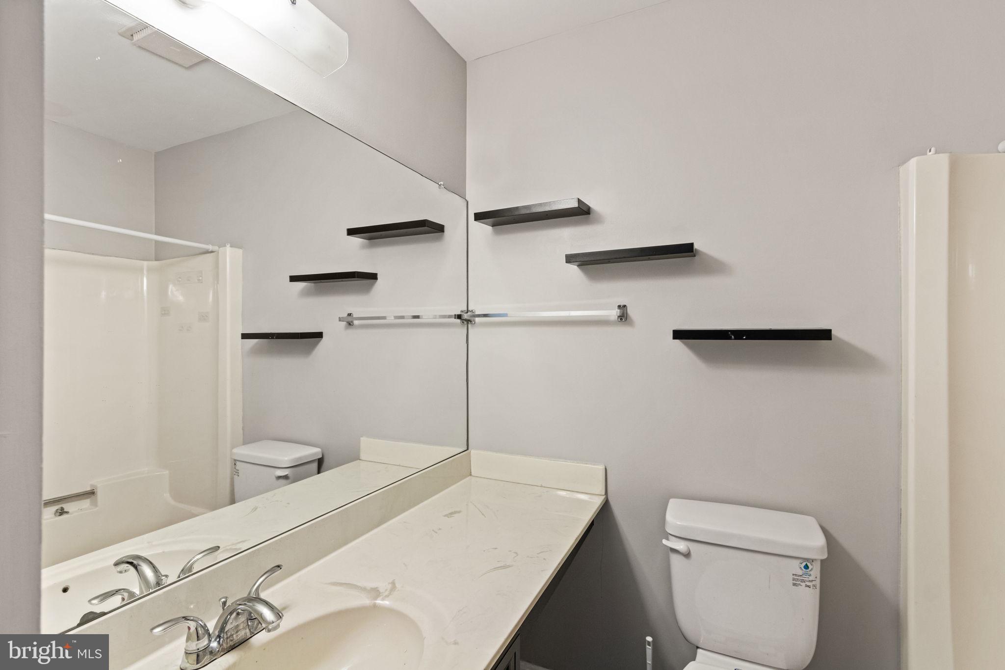 127 Oaklawn Road Stafford, VA 22554 - Photo 36 of 54 a bathroom with a sink a toilet and shower