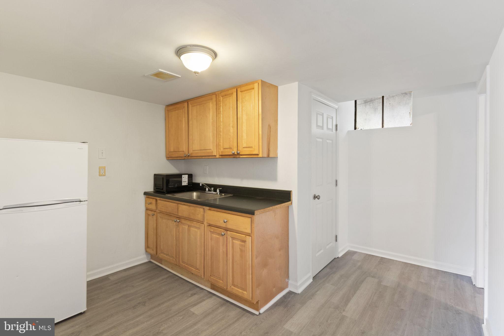 127 Oaklawn Road Stafford, VA 22554 - Photo 43 of 54 a kitchen with a refrigerator and a stove top oven