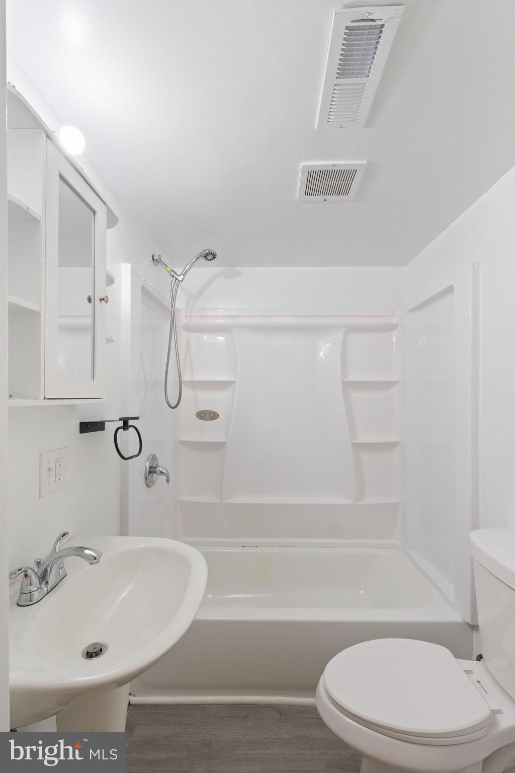 127 Oaklawn Road Stafford, VA 22554 - Photo 45 of 54 a bathroom with a sink a toilet and shower