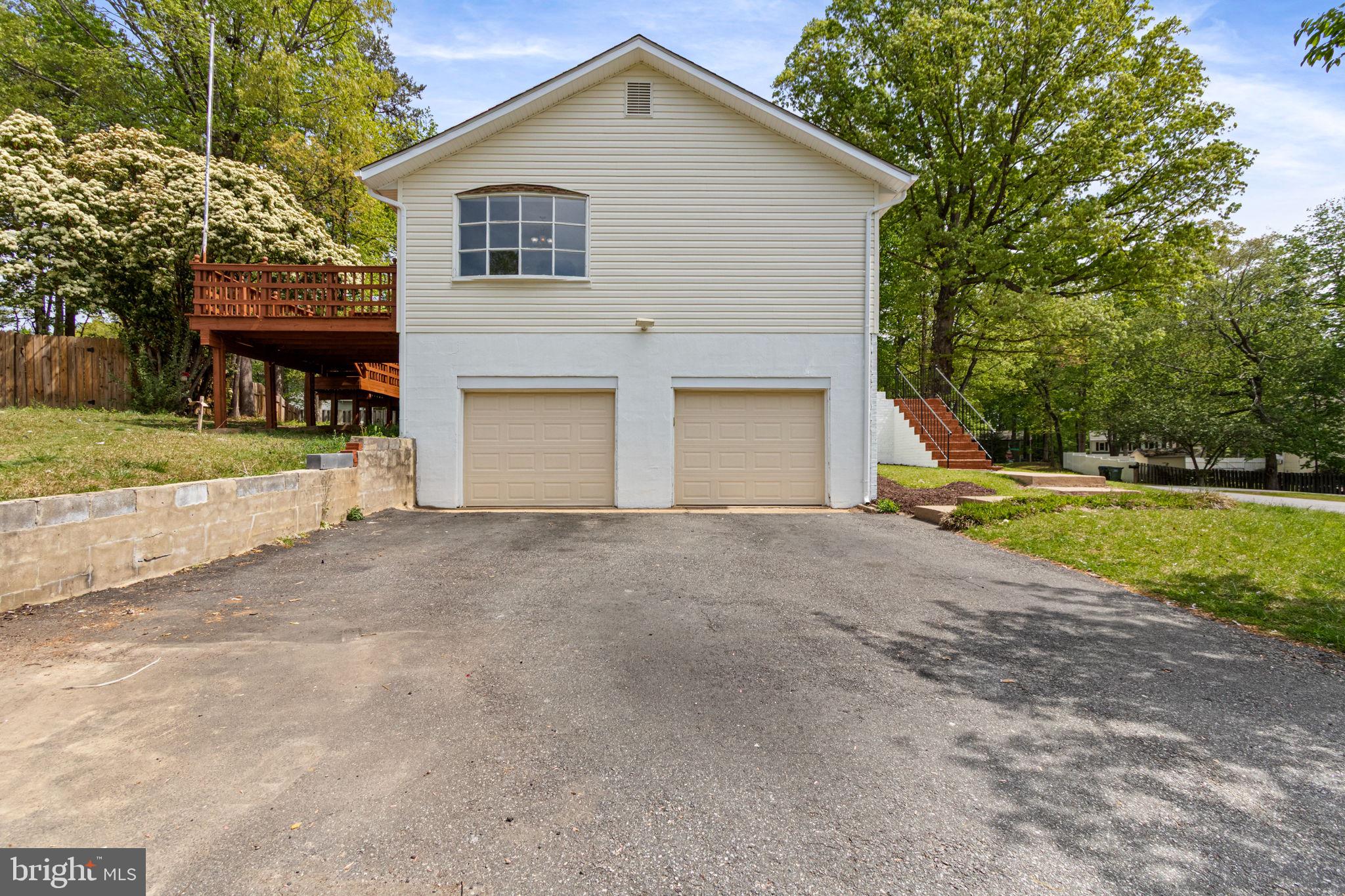 127 Oaklawn Road Stafford, VA 22554 - Photo 8 of 54 a view of a white house with a yard and large tree