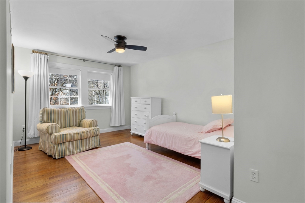 2 Thorndike Street, Unit 2 Brookline, MA 02446 - Photo 12 of 22 a bedroom with a bed and a couch