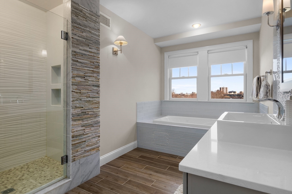 2 Thorndike Street, Unit 2 Brookline, MA 02446 - Photo 13 of 22 a bathroom with a bathtub and a sink