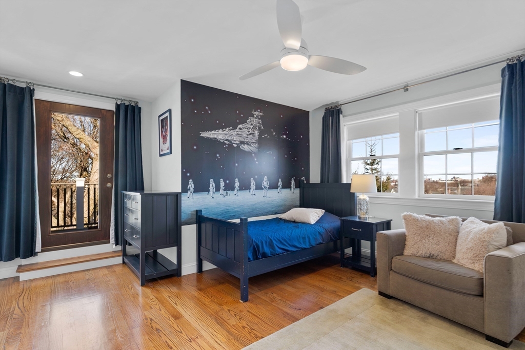 2 Thorndike Street, Unit 2 Brookline, MA 02446 - Photo 14 of 22 a living room with furniture and a large window