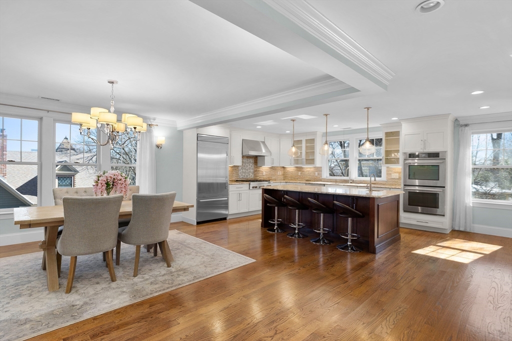 2 Thorndike Street, Unit 2 Brookline, MA 02446 - Photo 2 of 22 a dining area with furniture a kitchen view and kitchen view
