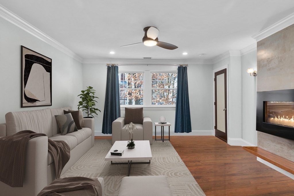 2 Thorndike Street, Unit 2 Brookline, MA 02446 - Photo 5 of 22 a living room with furniture fireplace and flat screen tv