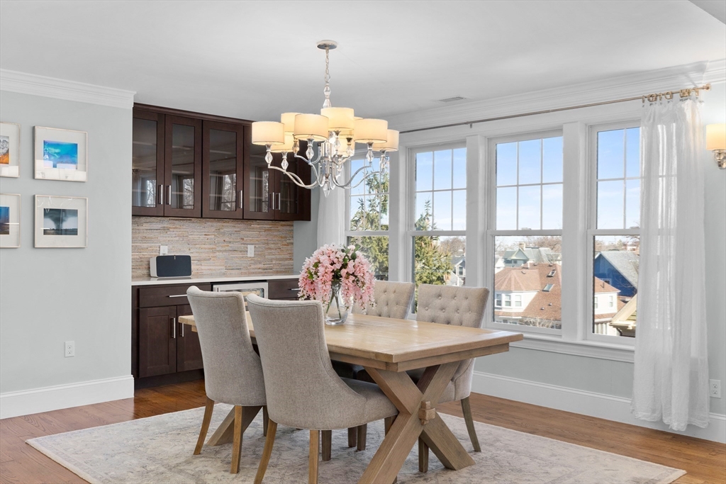 2 Thorndike Street, Unit 2 Brookline, MA 02446 - Photo 6 of 22 a view of a dining room with furniture window and wooden floor