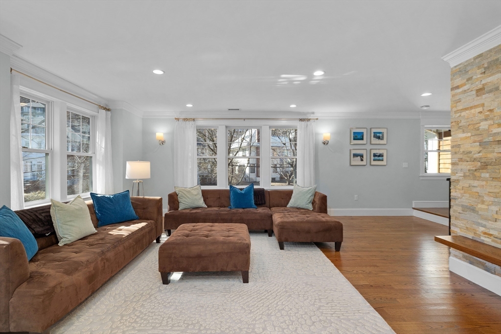 2 Thorndike Street, Unit 2 Brookline, MA 02446 - Photo 7 of 22 a living room with furniture and a large window