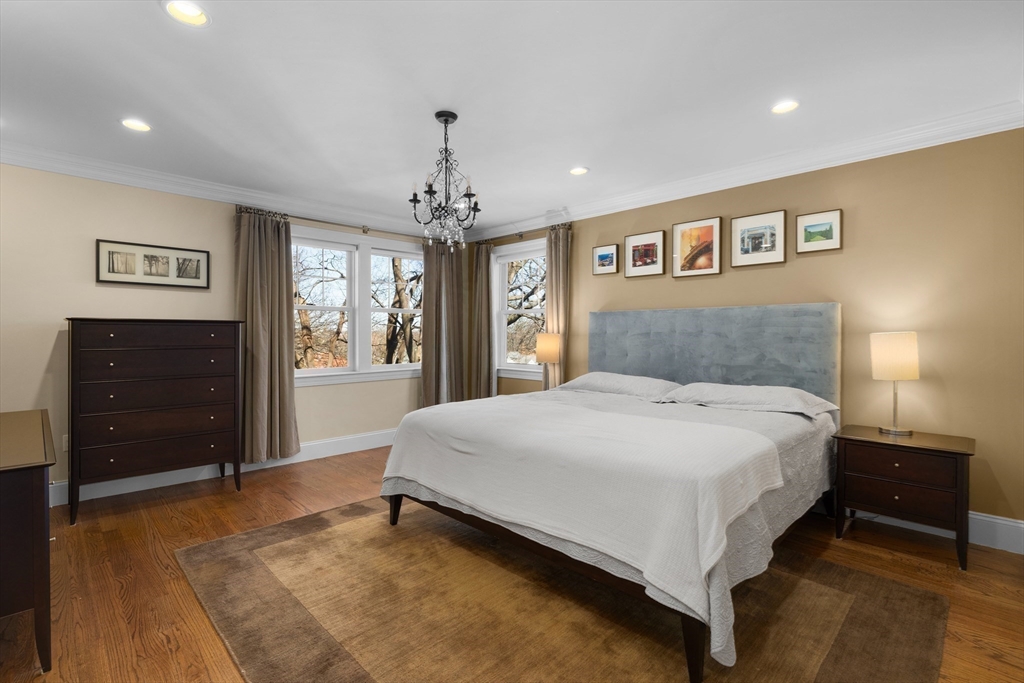 2 Thorndike Street, Unit 2 Brookline, MA 02446 - Photo 10 of 22 a bedroom with a large bed and a dresser