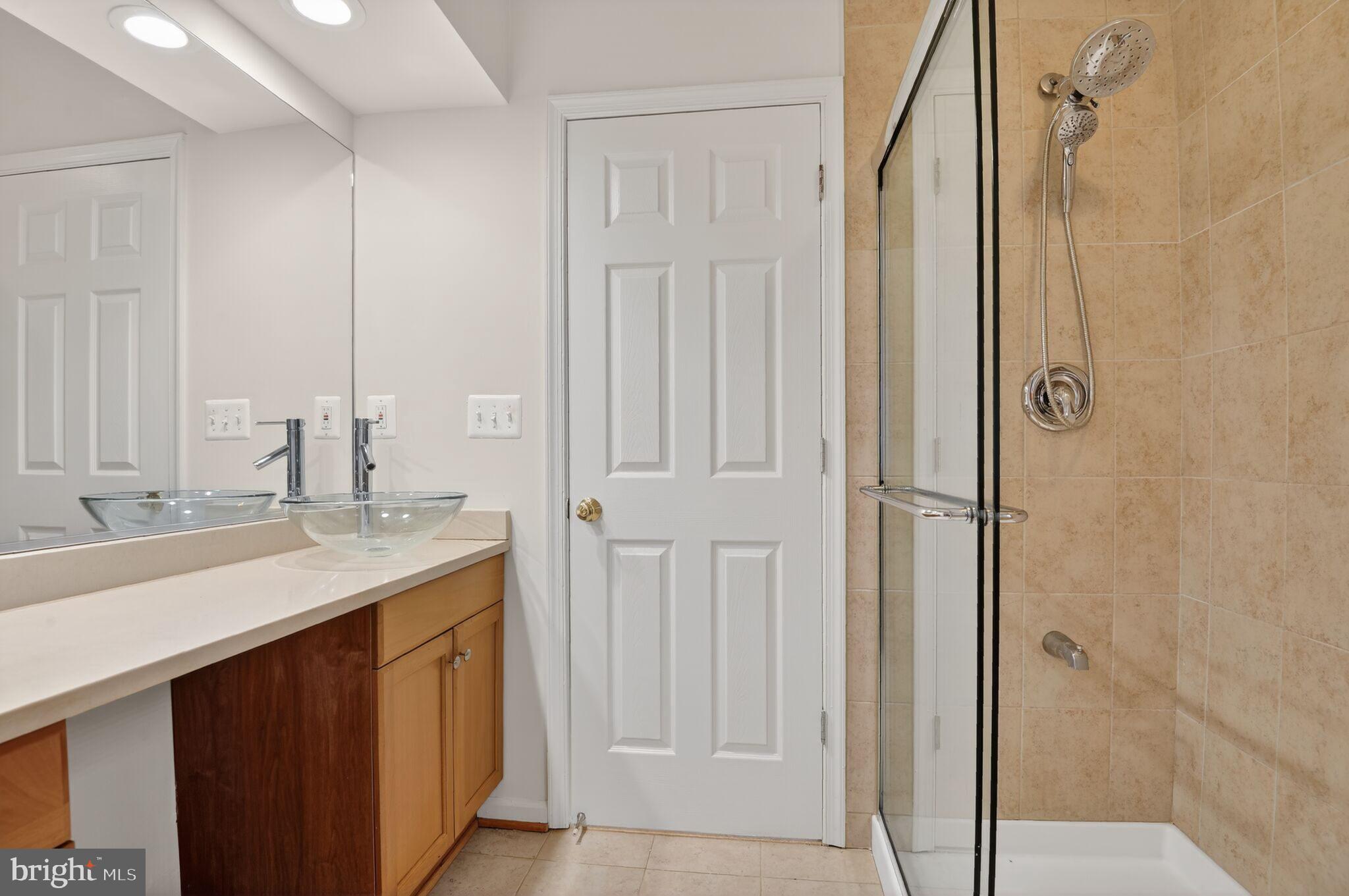 8301 Kings Ridge Court Springfield, VA 22153 - Photo 10 of 20 a bathroom with a sink and a mirror