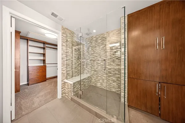 a view of a big room with entryway and stairs