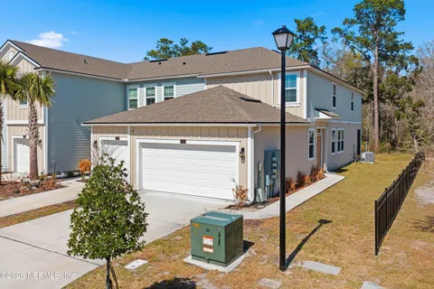 a aerial view of a house with a yard