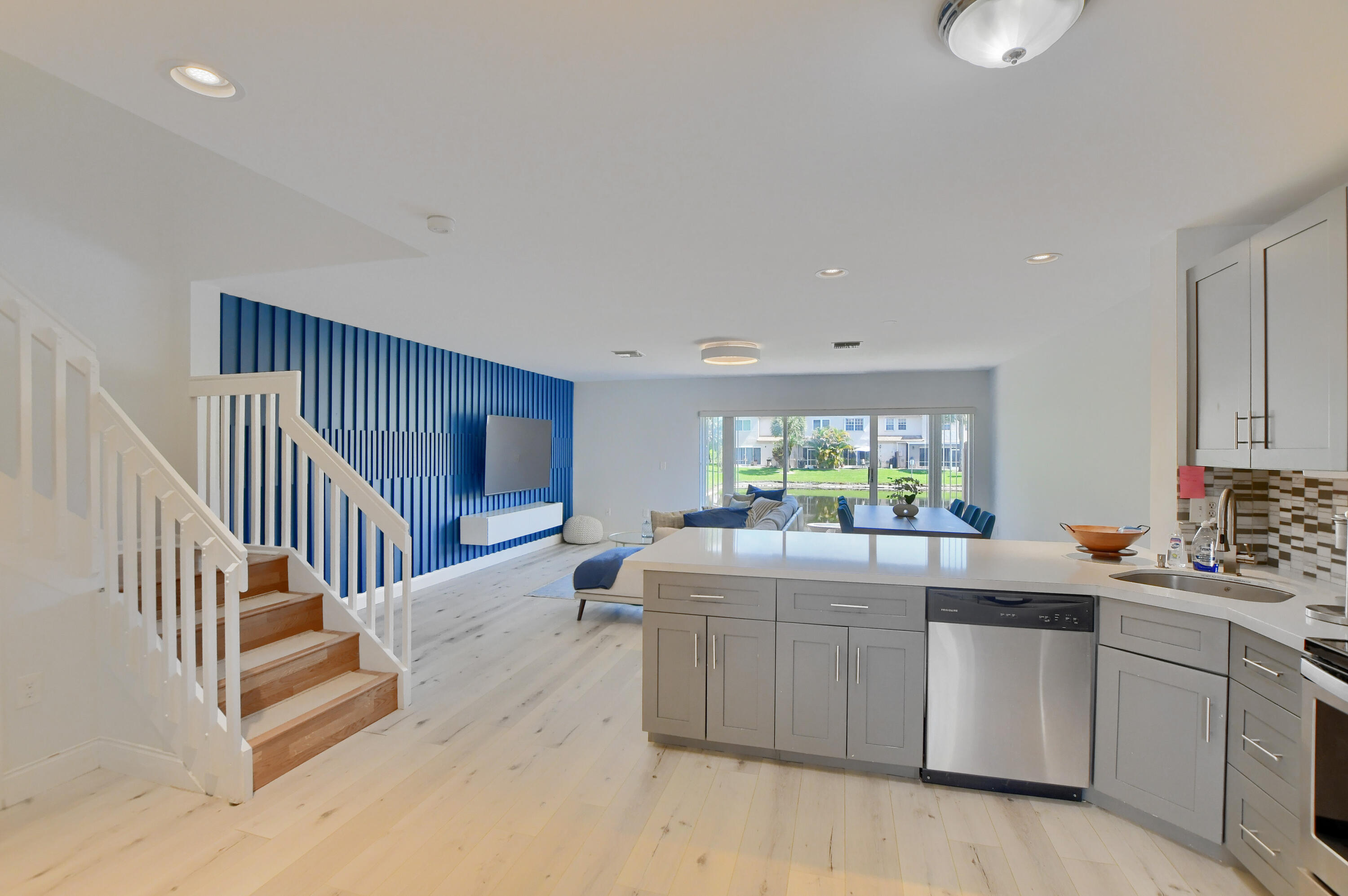 9389 Boca River Circle Boca Raton, FL 33434 - Photo 6 of 37 Kitchen and Living Area