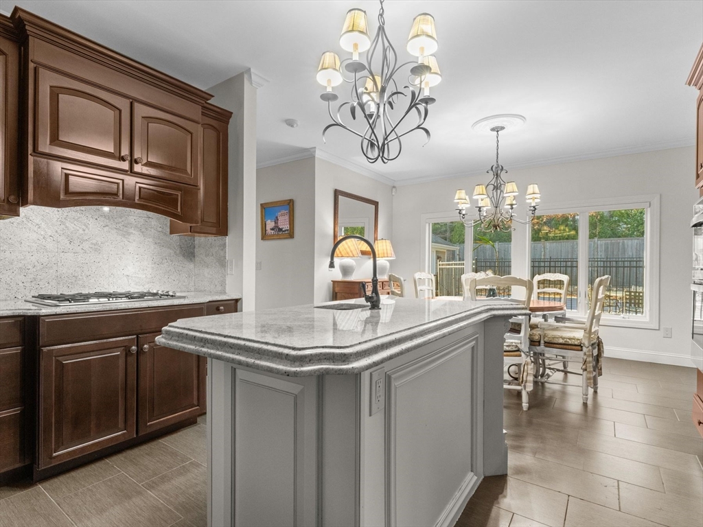 4 Quick Farm Road Westborough, MA 01581 - Photo 13 of 42 a kitchen with stainless steel appliances granite countertop a stove and cabinets