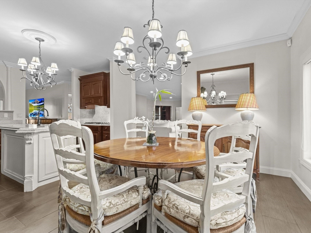 4 Quick Farm Road Westborough, MA 01581 - Photo 14 of 42 a view of a dining room with furniture and chandelier