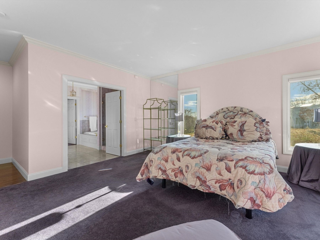 4 Quick Farm Road Westborough, MA 01581 - Photo 19 of 42 a bedroom with a large bed and a wooden floor