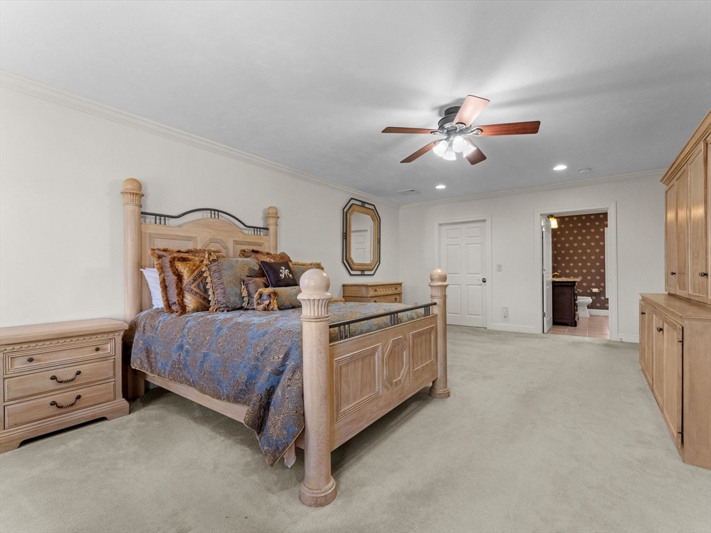 4 Quick Farm Road Westborough, MA 01581 - Photo 25 of 42 a bed room with a bed and a chandelier