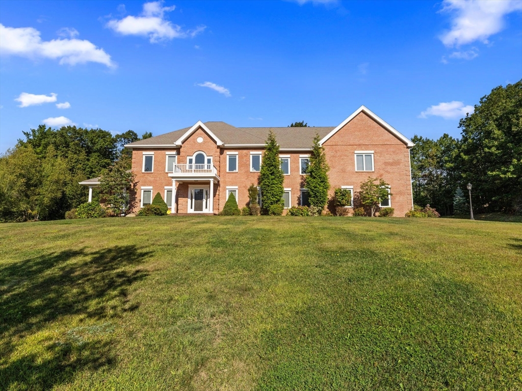 4 Quick Farm Road Westborough, MA 01581 - Photo 40 of 42 a front view of a house with a yard