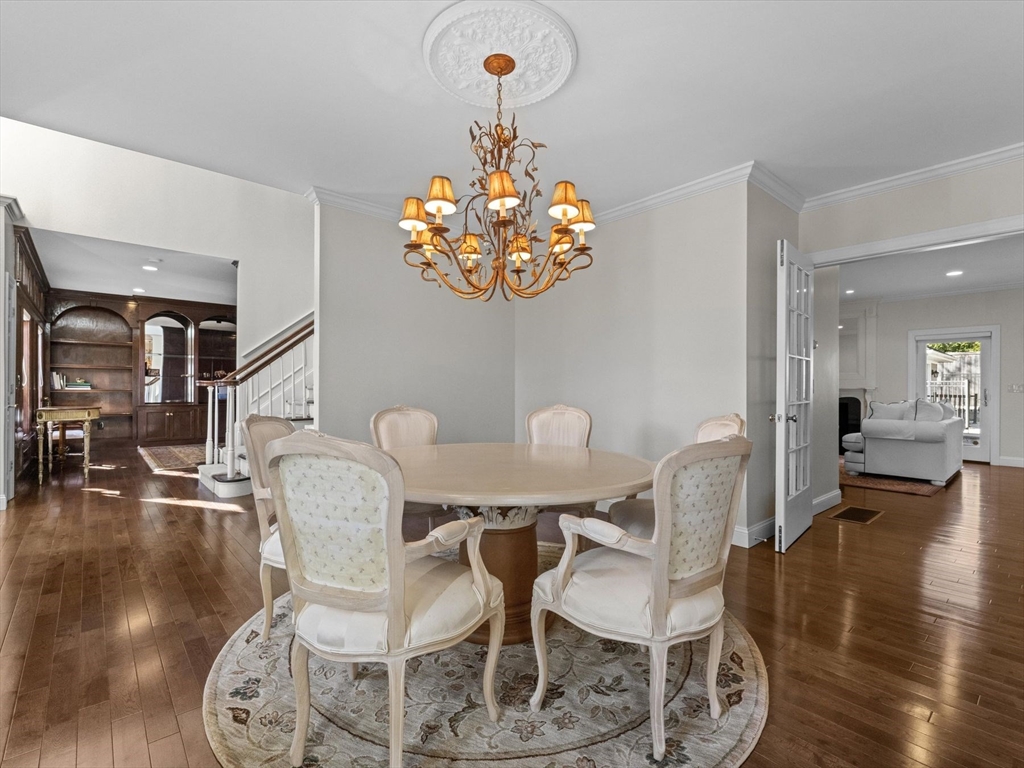 4 Quick Farm Road Westborough, MA 01581 - Photo 7 of 42 a dining room with furniture a chandelier and wooden floor