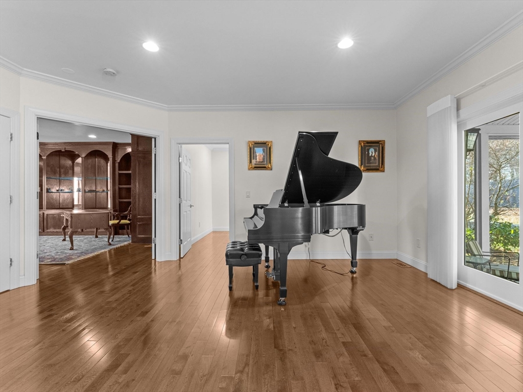 4 Quick Farm Road Westborough, MA 01581 - Photo 10 of 42 a view of a livingroom with wooden floor and a bathroom
