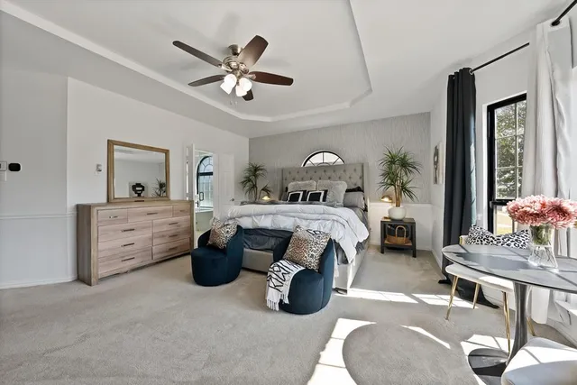 a bed room with furniture and a chandelier