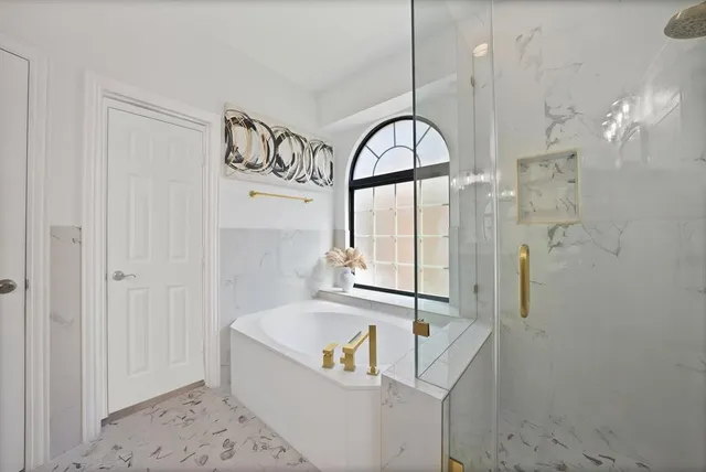 a spacious bathroom with a double vanity sink double and mirror