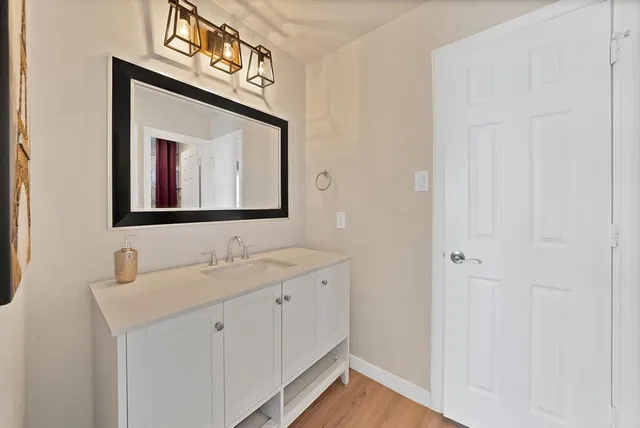a view of a bedroom with furniture window and a ceiling fan