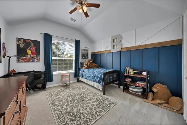 a bed room with furniture and a chandelier