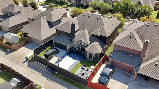 an aerial view of house with yard