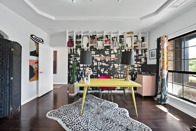 a room with furniture and a book shelf
