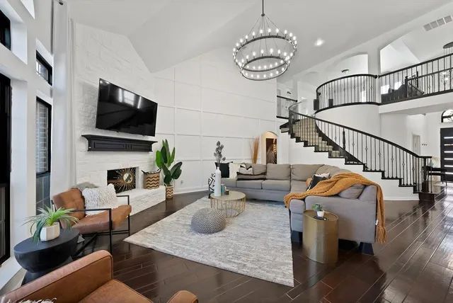 a living room with furniture fireplace and a flat screen tv