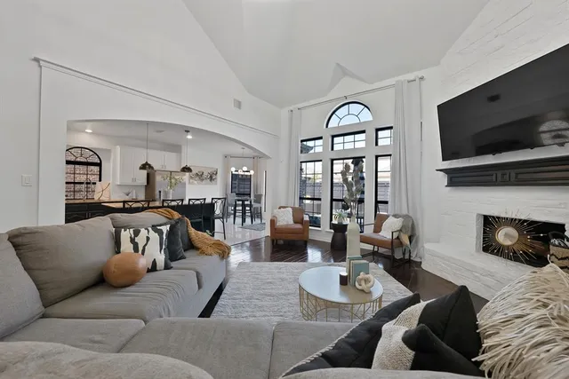 a living room with furniture fireplace and flat screen tv