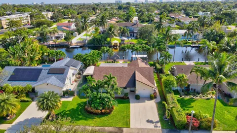 an aerial view of a houses with a yard