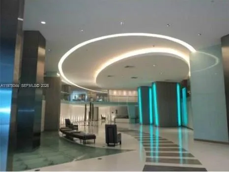 a kitchen with stainless steel appliances kitchen island granite countertop a sink and cabinets