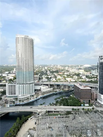 a view of a lake with tall buildings