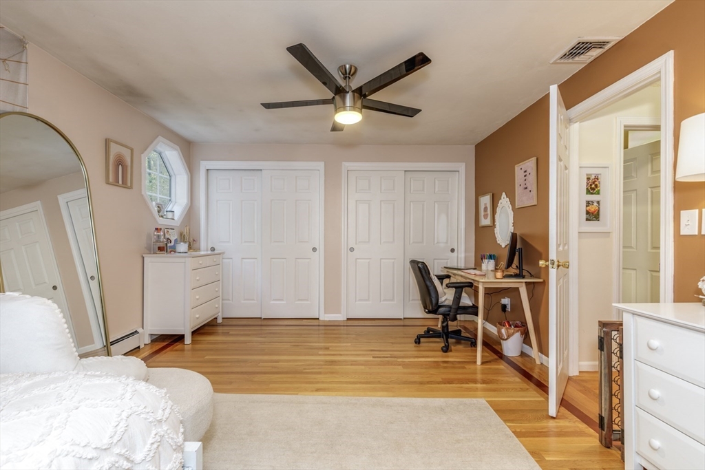 50 Kienia Road Hudson, NH 03051 - Photo 23 of 42 a view of a livingroom with furniture and a ceiling fan