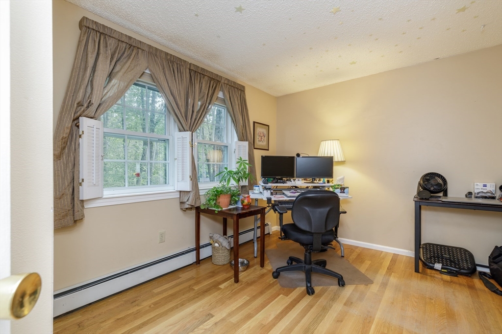 50 Kienia Road Hudson, NH 03051 - Photo 26 of 42 a view of a workspace with furniture and a window