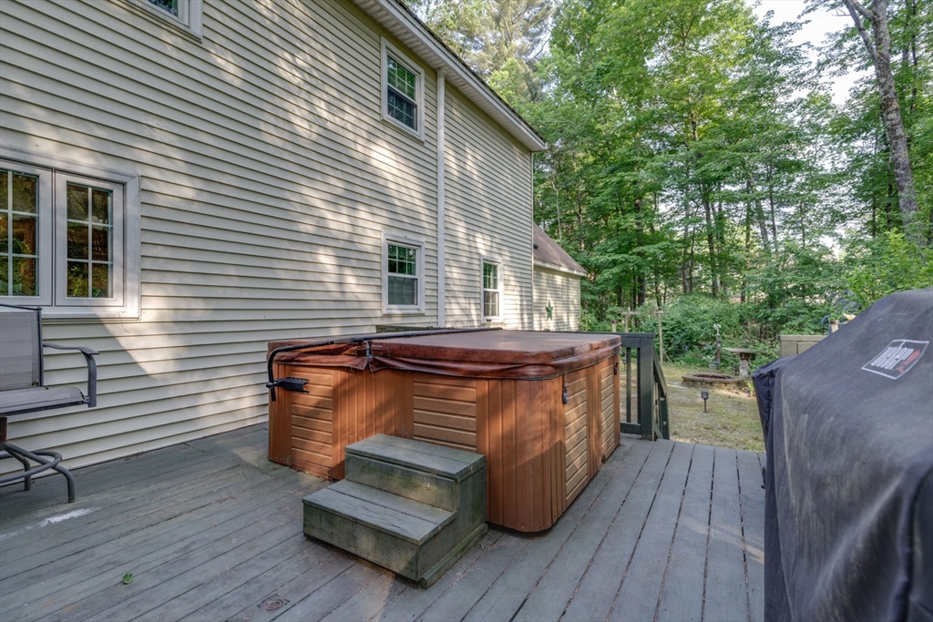 50 Kienia Road Hudson, NH 03051 - Photo 37 of 42 a view of backyard with a deck and wooden floor