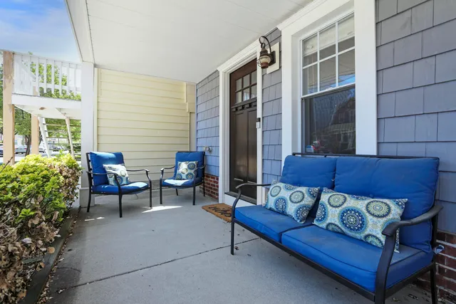 a outdoor living space with furniture and a potted plant