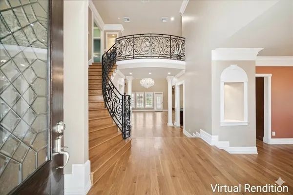 a view of entryway with wooden floor